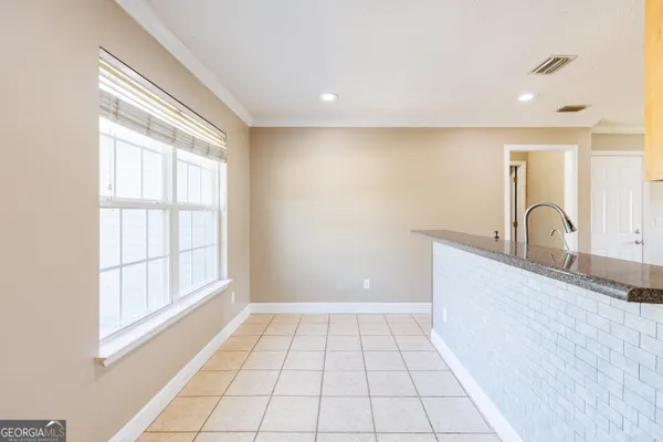 a view of a kitchen with a sink and windows