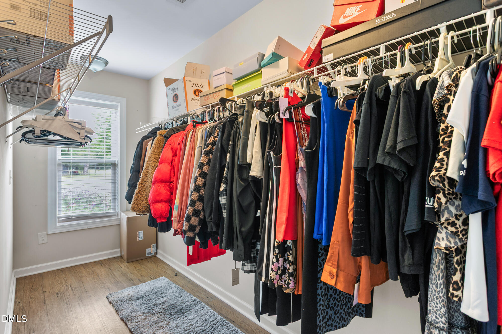3163 Saul Loop Road Elon, NC 27244 - Photo 30 of 44 a view of walk in closet with clothes