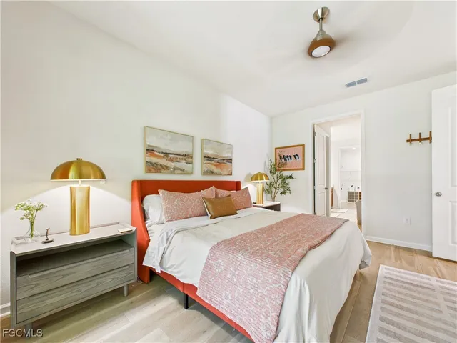 a bedroom with bed and window