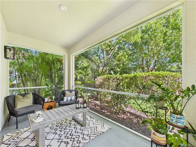 a room with furniture and a large window