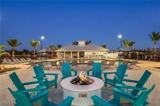 a dining room with furniture and a wooden floor