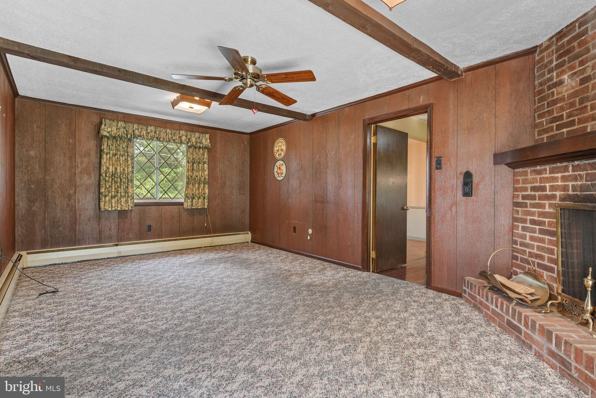 1818 Roxboro Road York, PA 17402 - Photo 16 of 39 an empty room with windows and fan