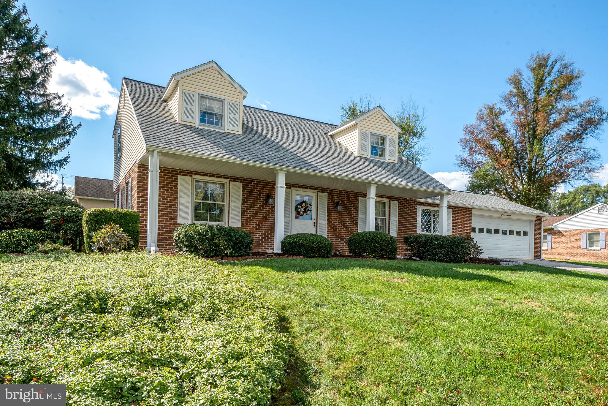 1818 Roxboro Road York, PA 17402 - Photo 2 of 39 a front view of a house with a yard