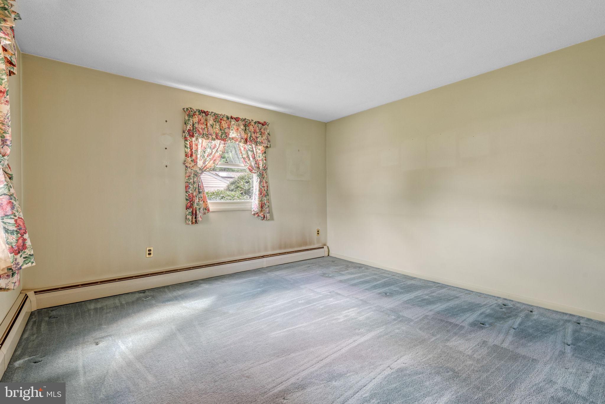 1818 Roxboro Road York, PA 17402 - Photo 21 of 39 an empty room with windows