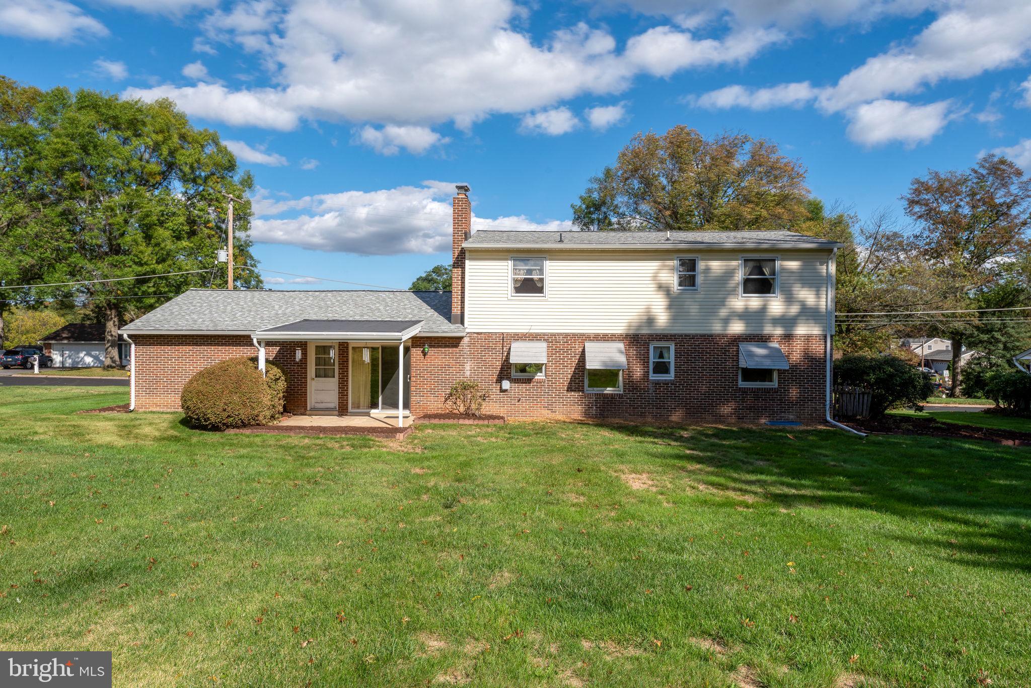 1818 Roxboro Road York, PA 17402 - Photo 33 of 39 a view of a house with a big yard and large trees