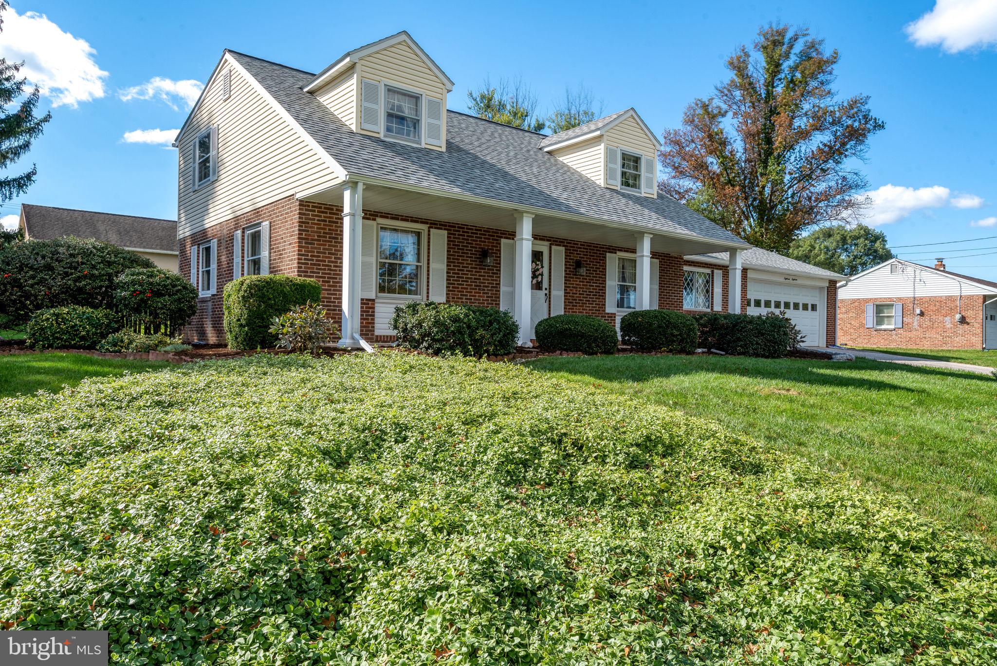 1818 Roxboro Road York, PA 17402 - Photo 36 of 39 a front view of a house with garden