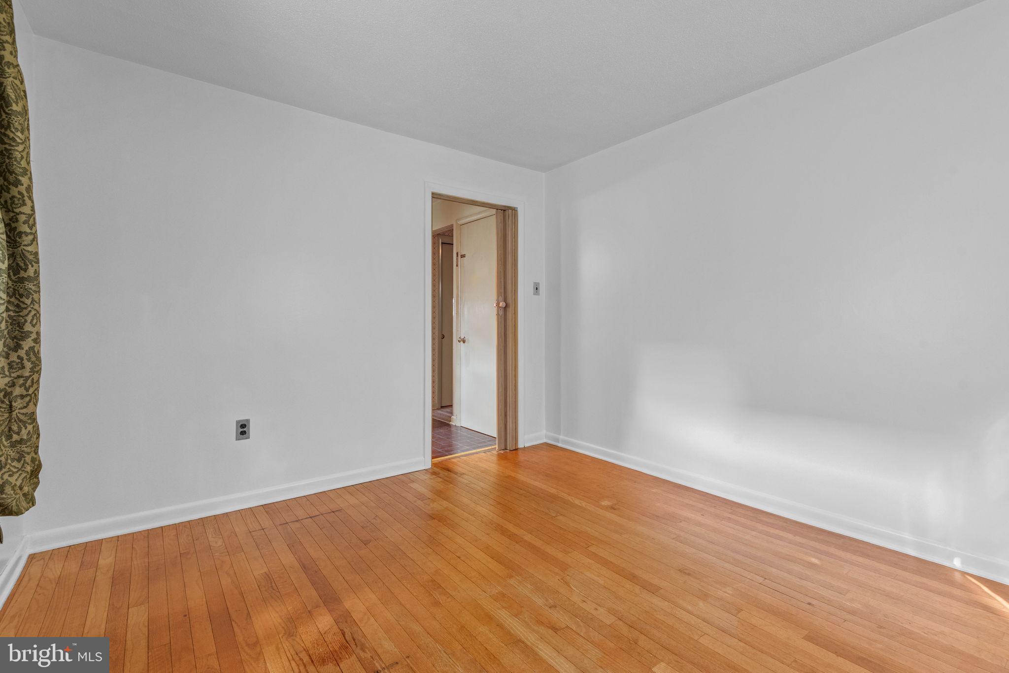 1818 Roxboro Road York, PA 17402 - Photo 8 of 39 a view of a room with wooden floor