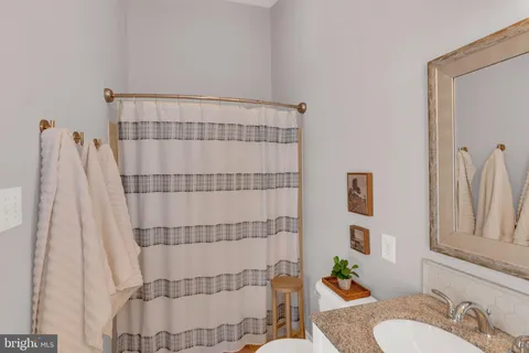 a bed room with a bed mirror and a window