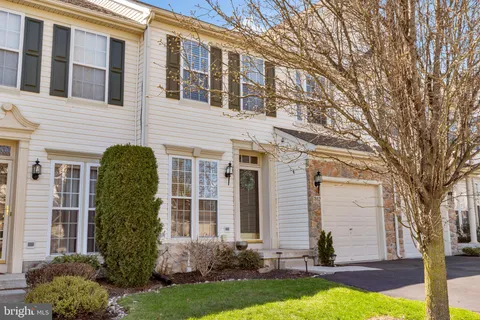 a front view of a house with yard