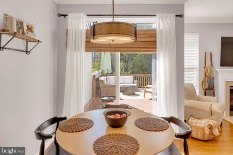 a living room with lots of furniture and kitchen view