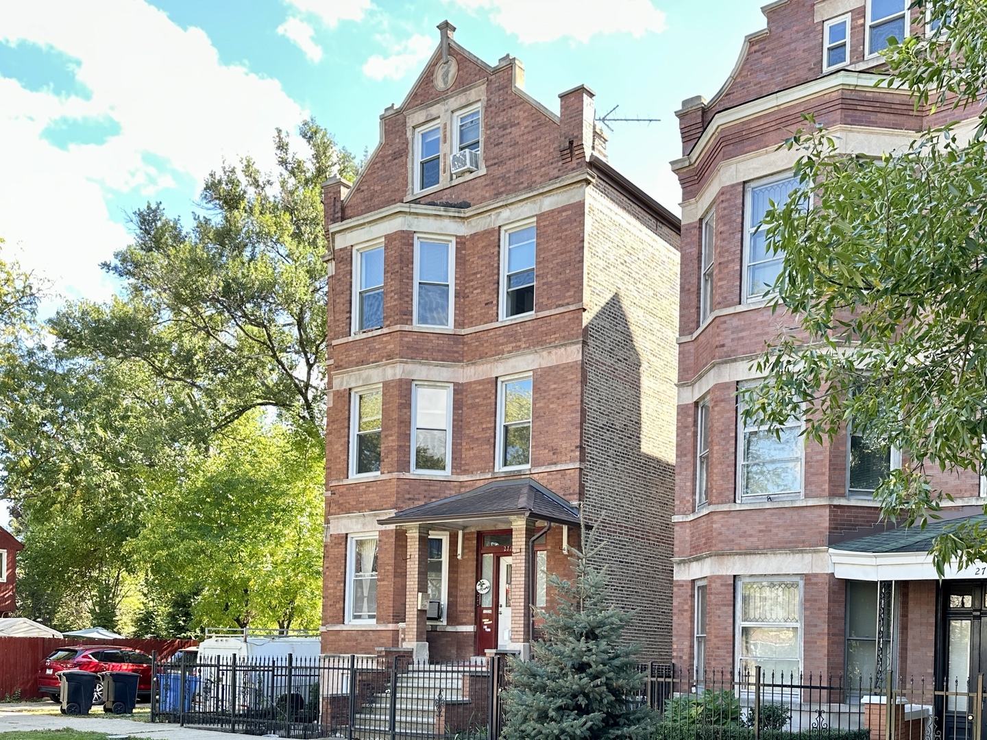 2713 West 16th Street, Unit 3 Chicago, IL 60608 - Photo 1 of 20 a front view of a residential apartment building with a yard
