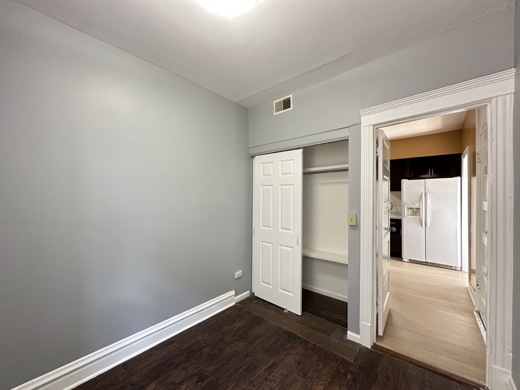 2713 West 16th Street, Unit 3 Chicago, IL 60608 - Photo 19 of 20 an empty room with wooden floor closet and windows