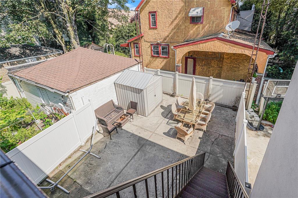 106 Village Road South Brooklyn, NY 11223 - Photo 13 of 42 a view of a house with patio