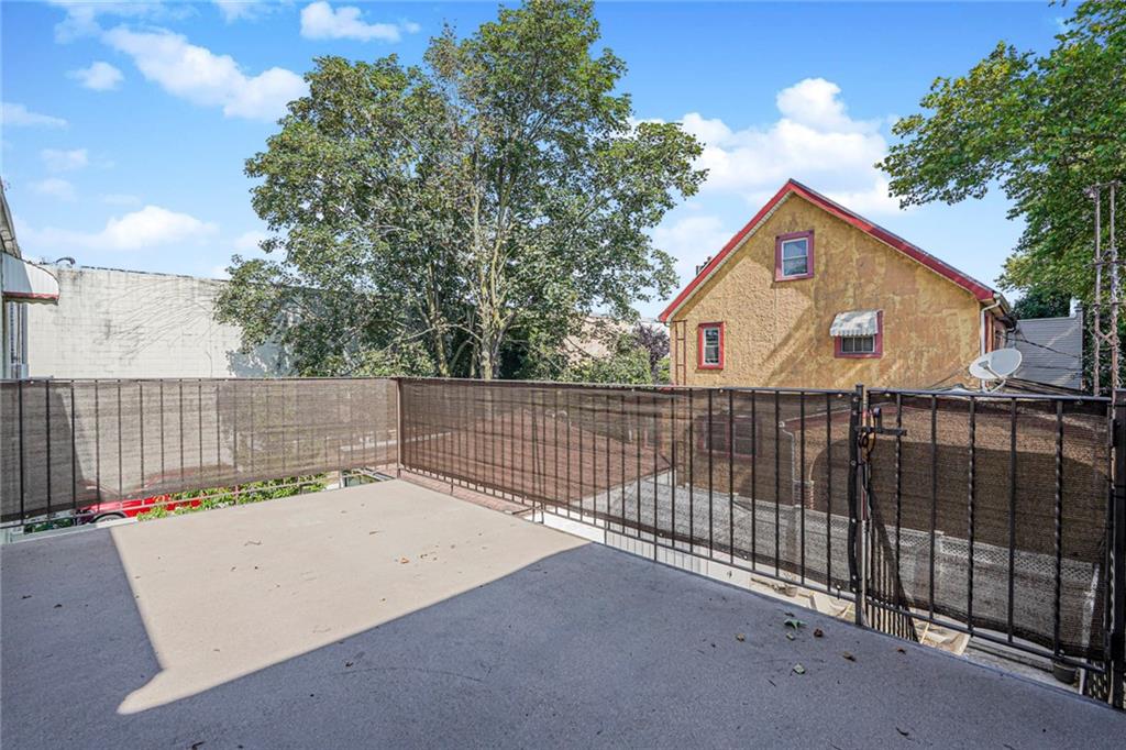 106 Village Road South Brooklyn, NY 11223 - Photo 15 of 42 a house view with a backyard