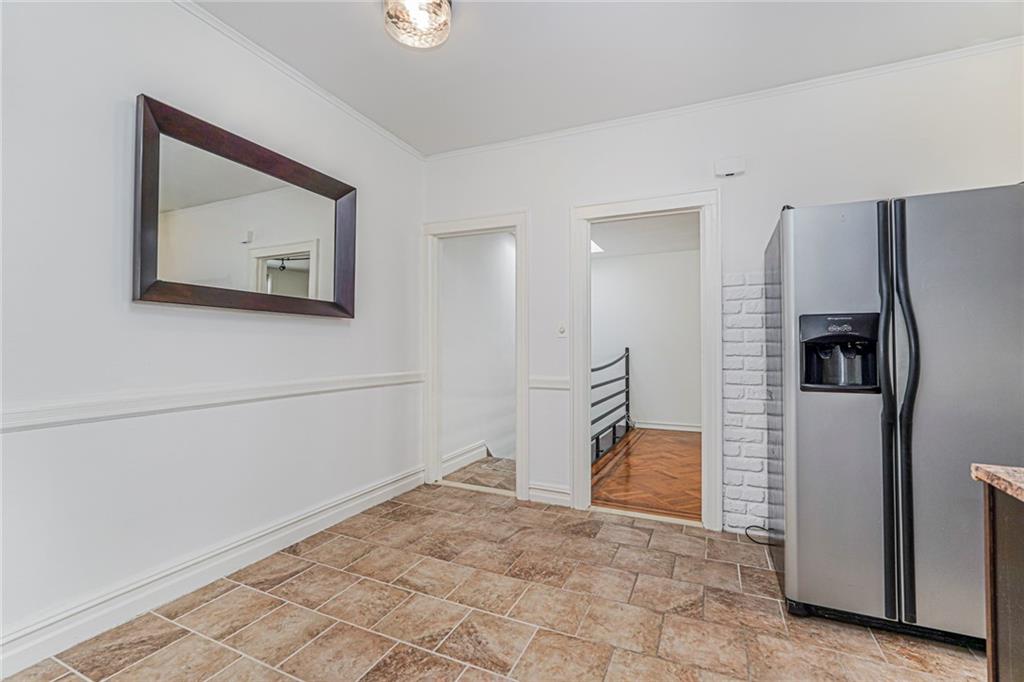 106 Village Road South Brooklyn, NY 11223 - Photo 33 of 42 a view of a hallway with staircase