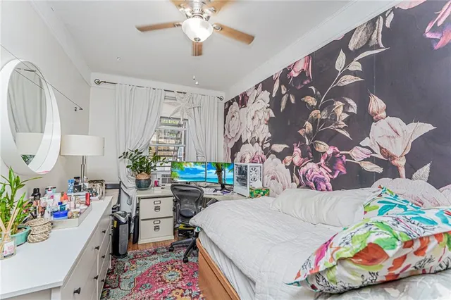 a bedroom with a large bed and a window