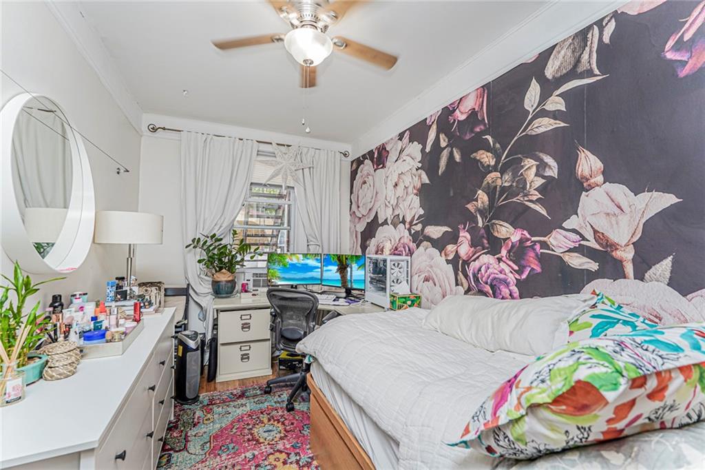 106 Village Road South Brooklyn, NY 11223 - Photo 37 of 42 a room that has a bed and a chair in it