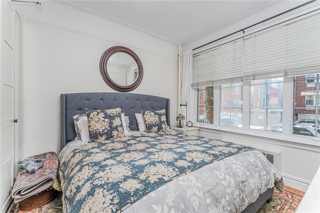 106 Village Road South Brooklyn, NY 11223 - Photo 38 of 42 a bedroom with a large bed and a window