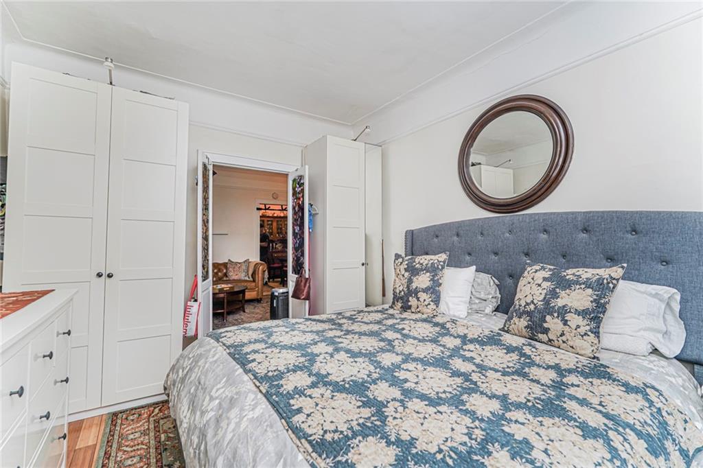 106 Village Road South Brooklyn, NY 11223 - Photo 40 of 42 a bedroom with bed and a closet