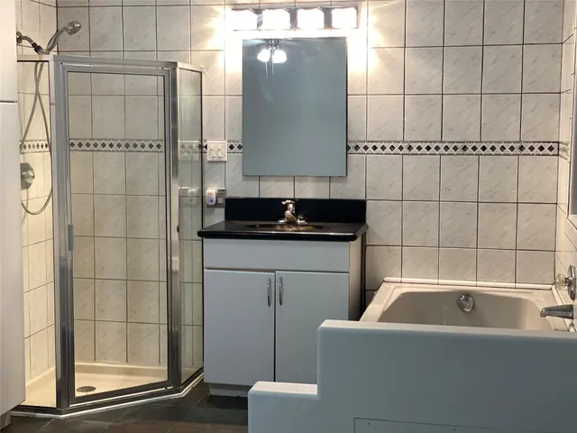 a bathroom with a bathtub sink and toilet