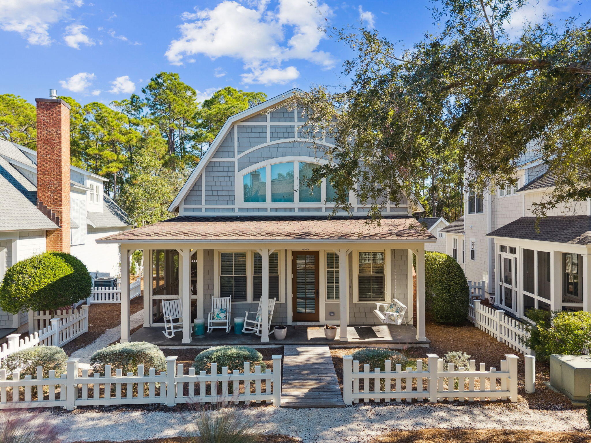 a front view of a house with garden