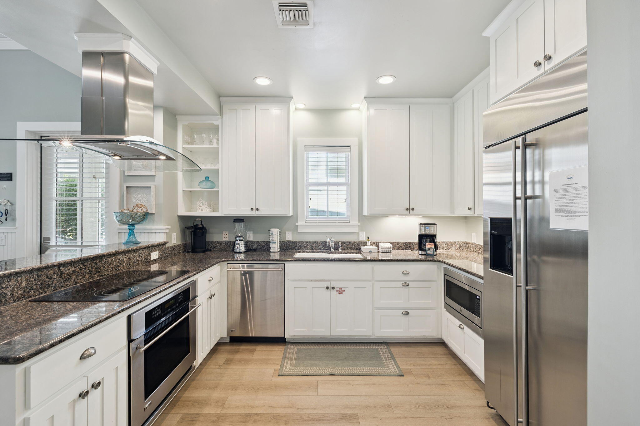 261 Salt Lane Inlet Beach, FL 32461 - Photo 11 of 36 a kitchen with a sink stove cabinets and refrigerator