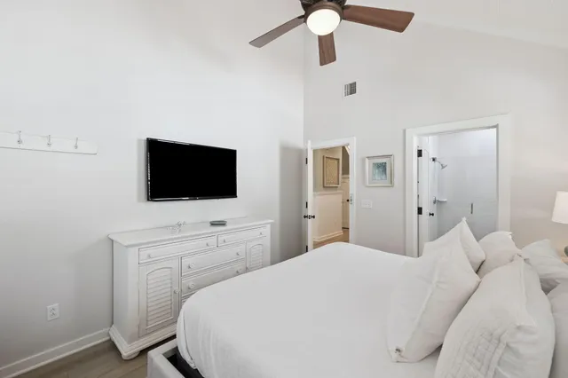a bathroom with a sink vanity mirror and toilet