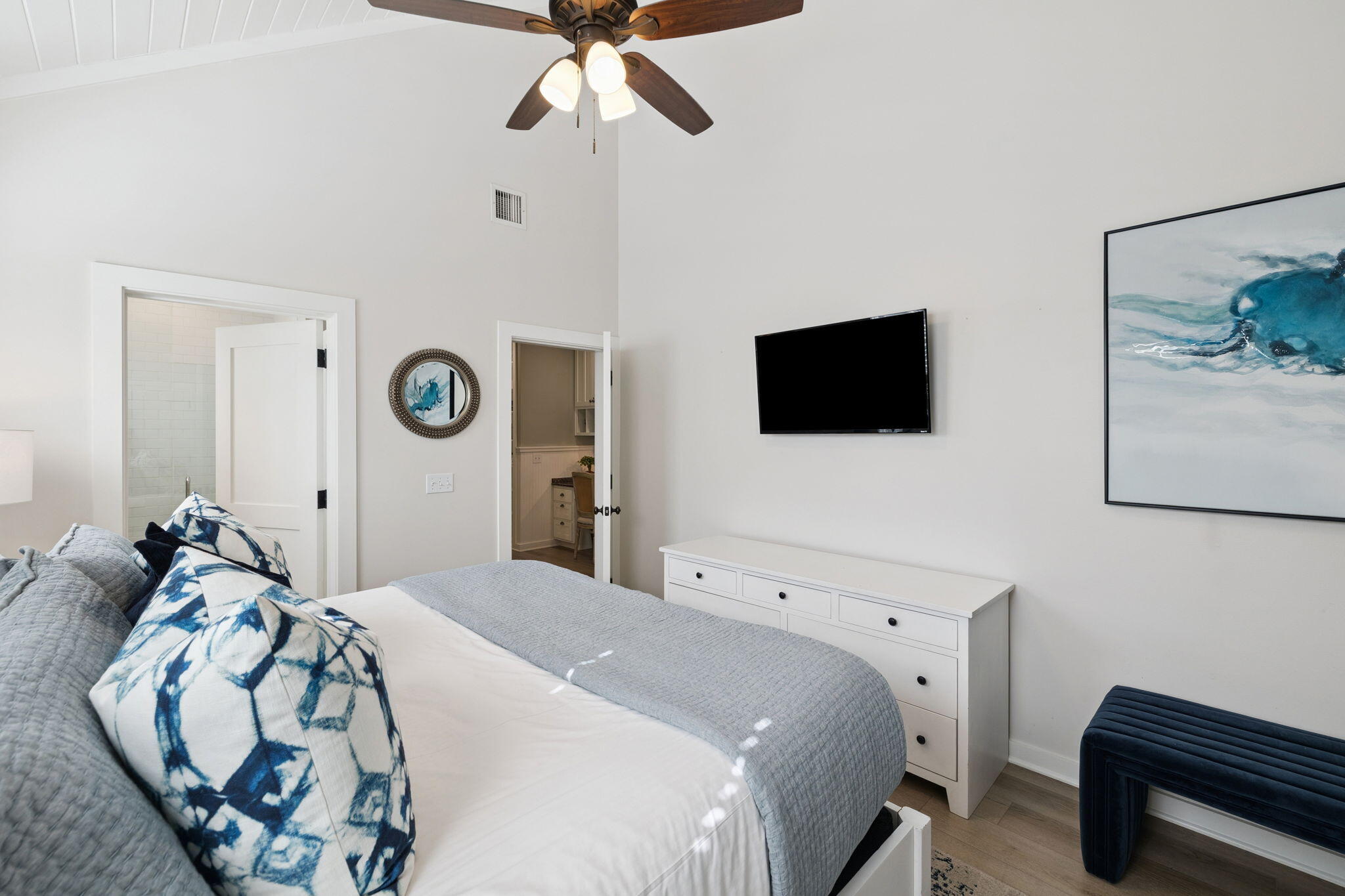 261 Salt Lane Inlet Beach, FL 32461 - Photo 16 of 36 a bedroom with a bed and a flat tv screen on the dresser