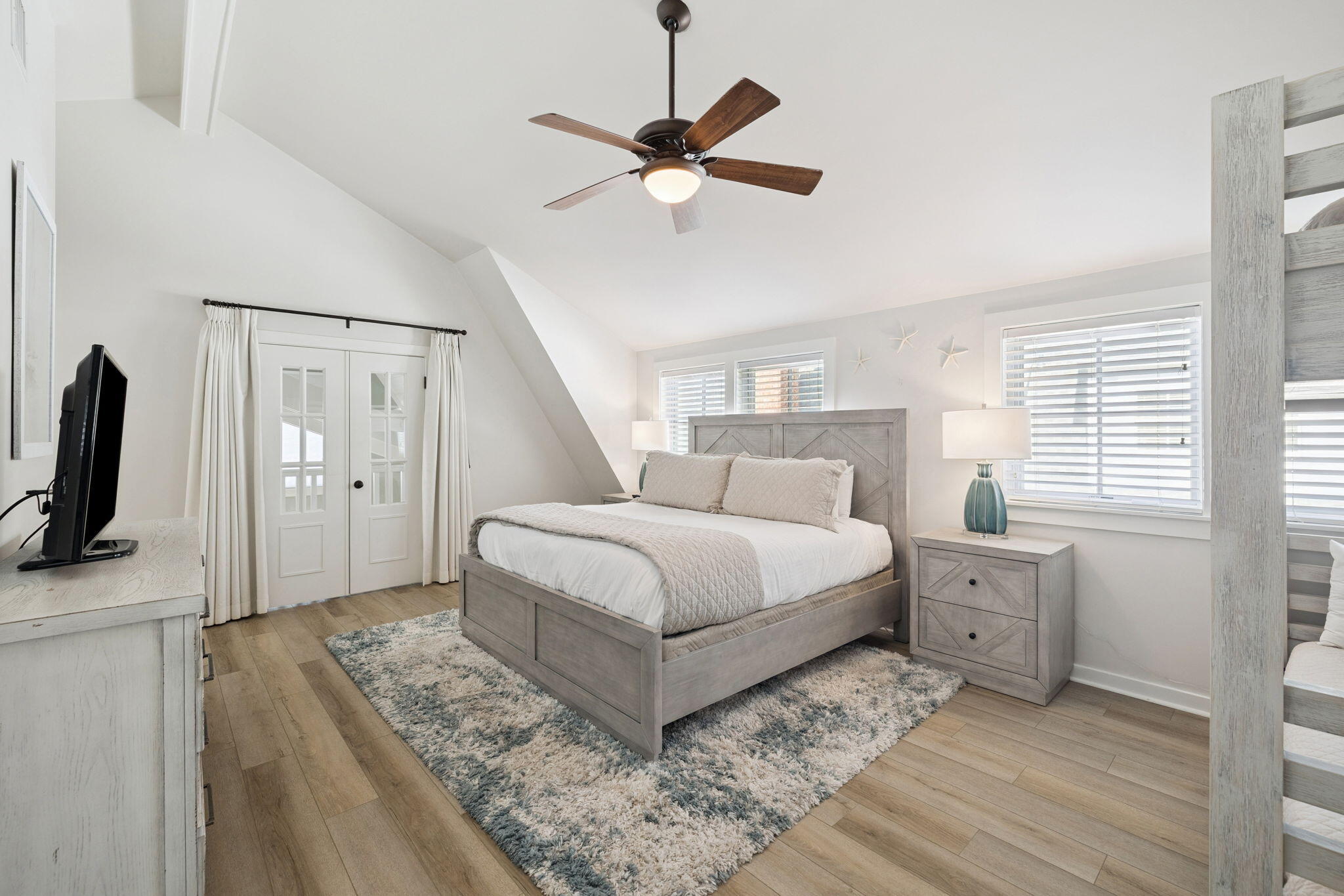 261 Salt Lane Inlet Beach, FL 32461 - Photo 21 of 36 a bedroom with a bed and a flat screen tv