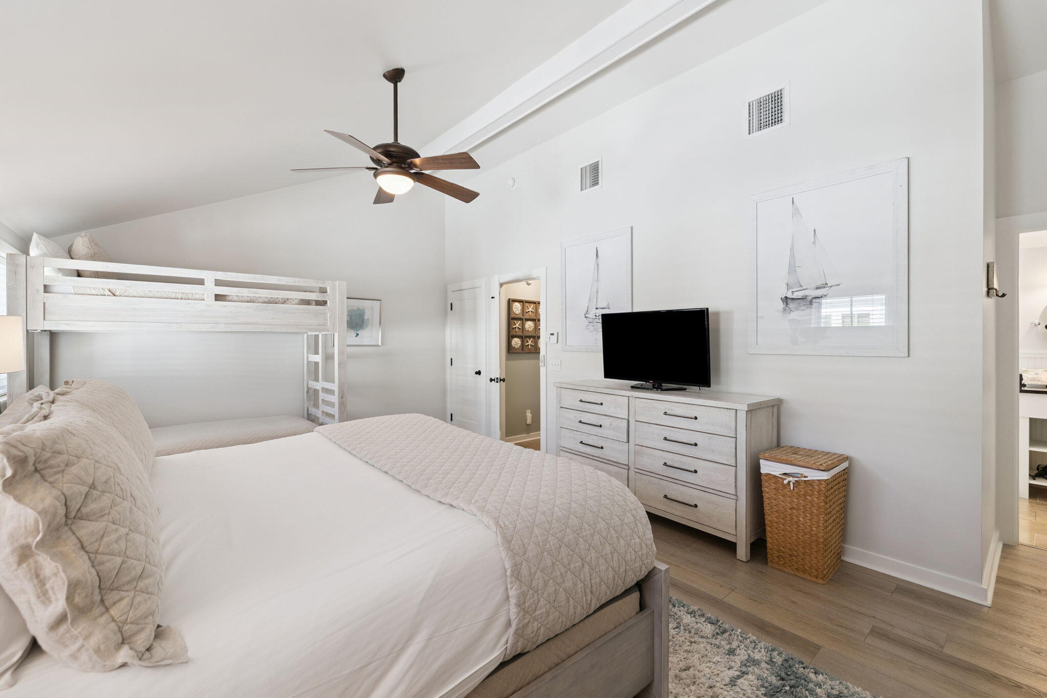 261 Salt Lane Inlet Beach, FL 32461 - Photo 22 of 36 a bedroom with a bed flat screen tv and a couch