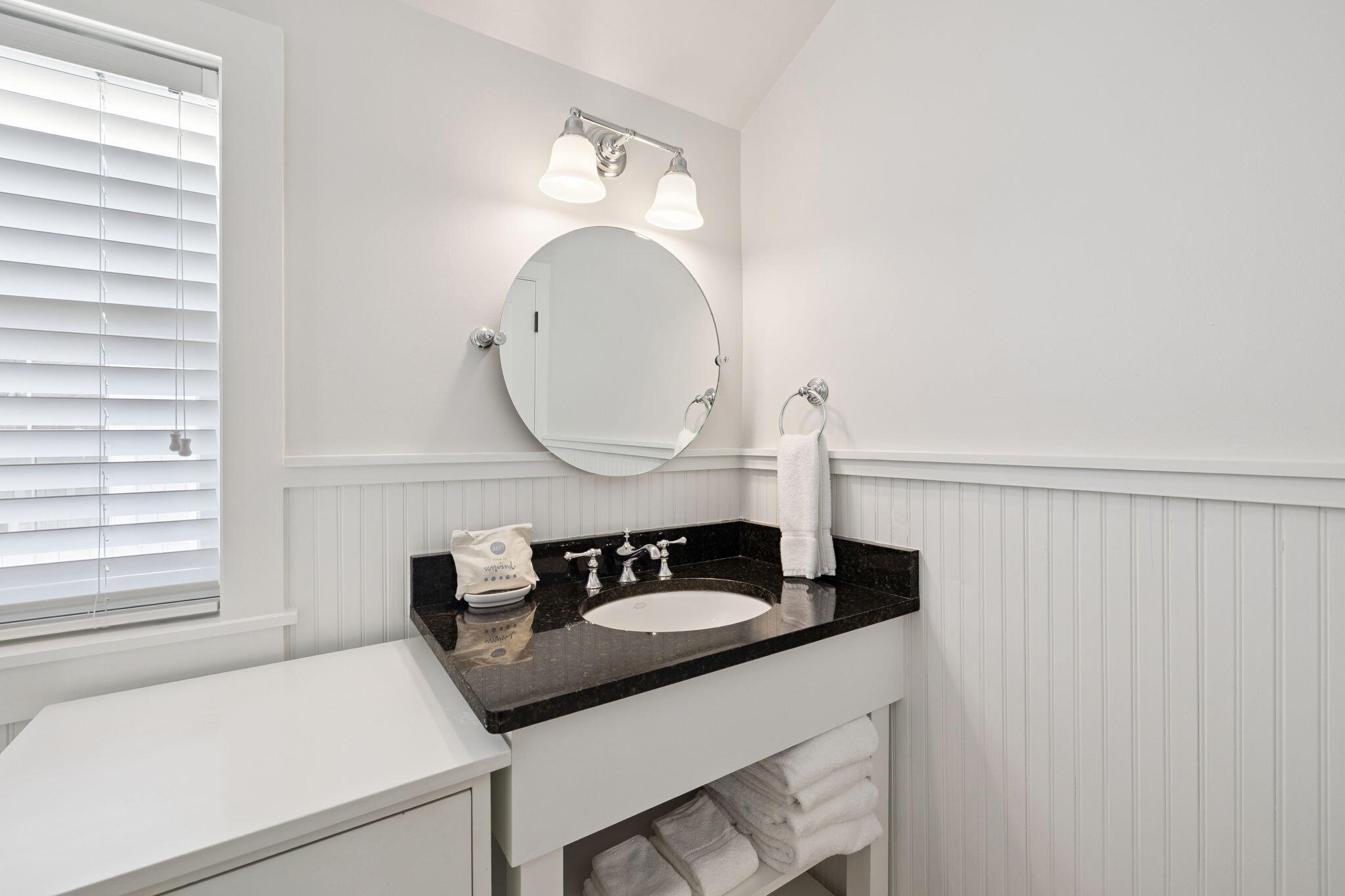 261 Salt Lane Inlet Beach, FL 32461 - Photo 24 of 36 a kitchen with a sink cabinets and a window