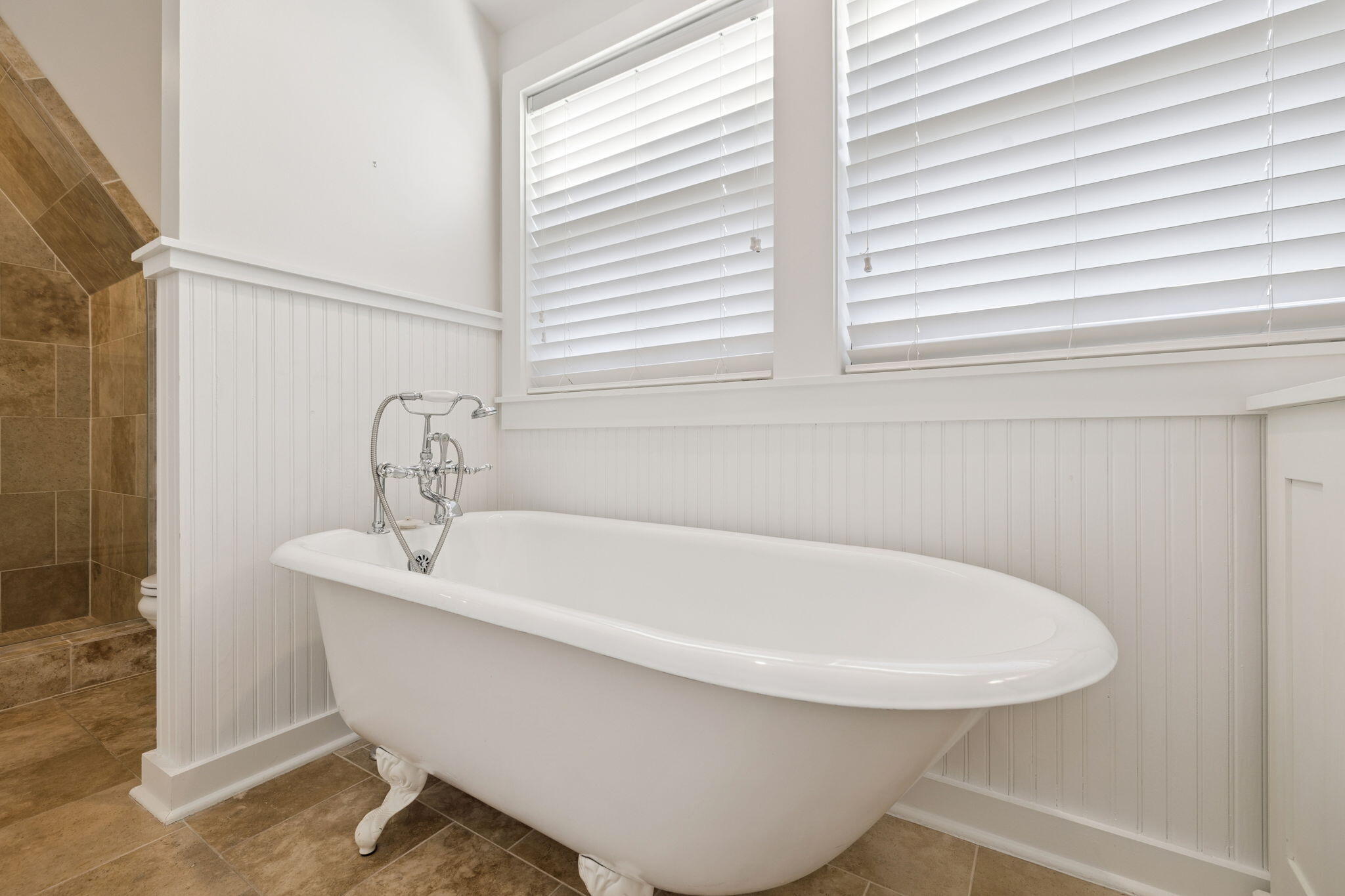 261 Salt Lane Inlet Beach, FL 32461 - Photo 26 of 36 a white bath tub sitting in a bathroom next to a window