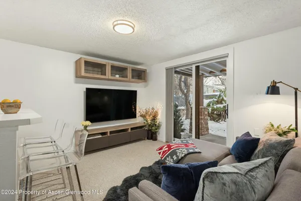 a kitchen with refrigerator and window