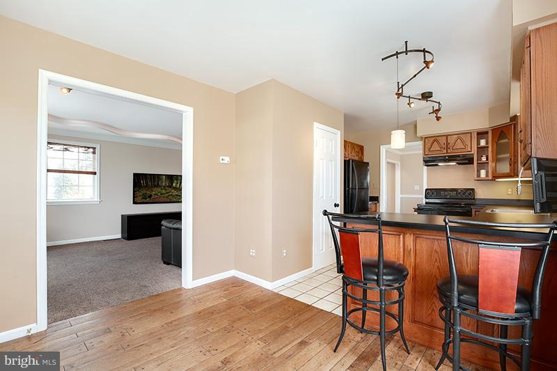 3826 Bark Hill Road Union Bridge, MD 21791 - Photo 14 of 30 a view of a dining room with furniture and wooden floor
