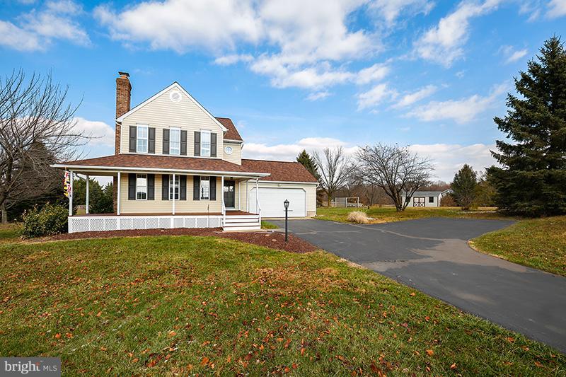 3826 Bark Hill Road Union Bridge, MD 21791 - Photo 3 of 30 a front view of a house with a yard