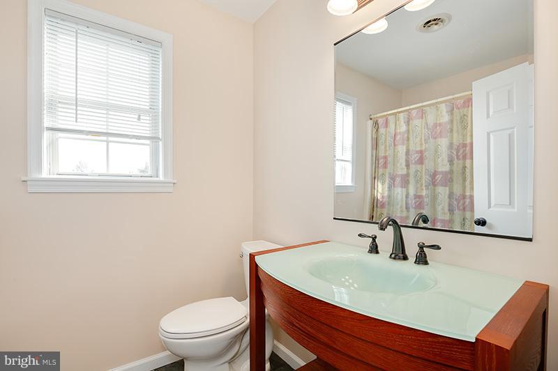 3826 Bark Hill Road Union Bridge, MD 21791 - Photo 23 of 30 a bathroom with a sink a toilet and a mirror