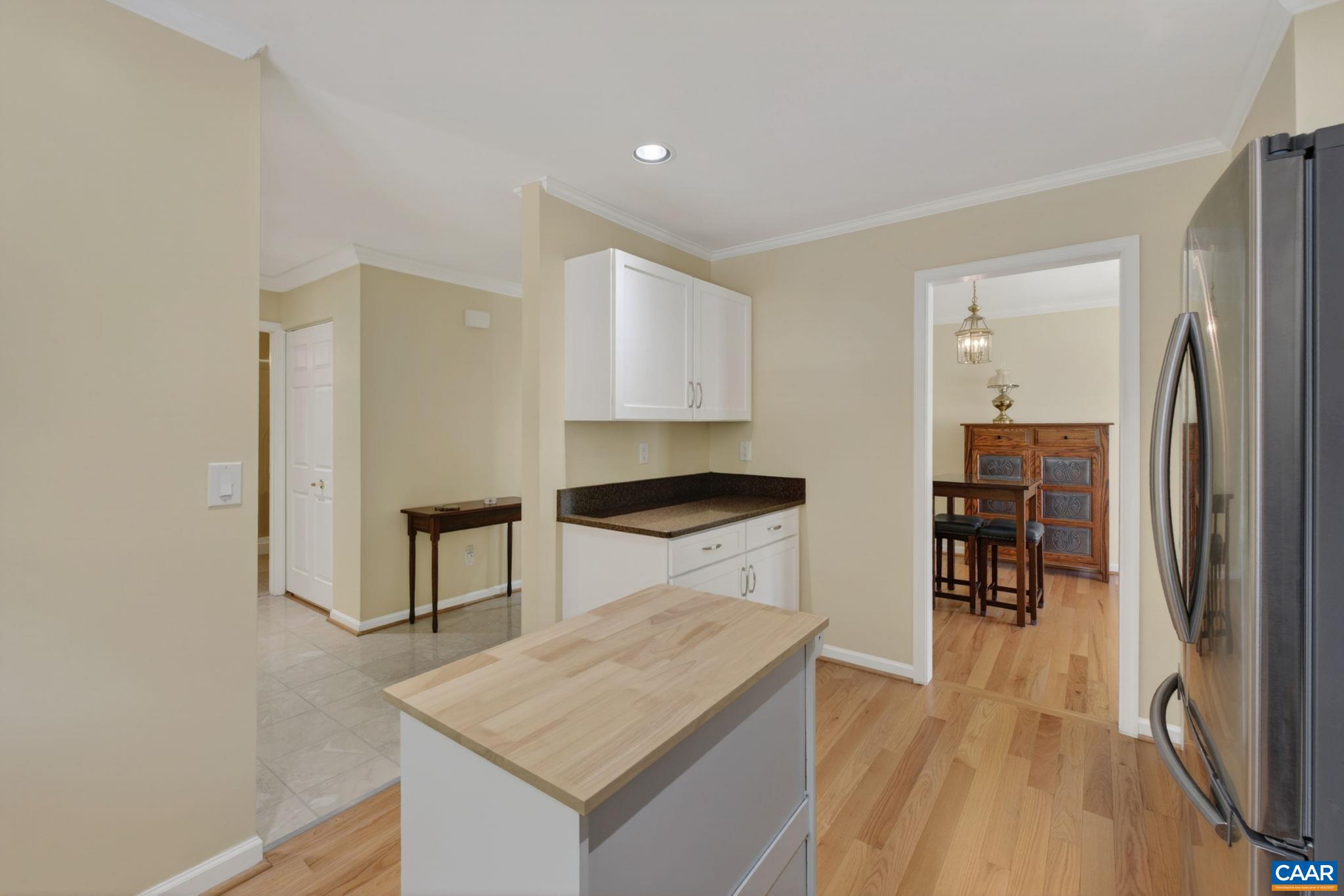 590 Mockingbird Way Charlottesville, VA 22901 - Photo 13 of 43 a kitchen with stainless steel appliances granite countertop a refrigerator a stove and a wooden floors