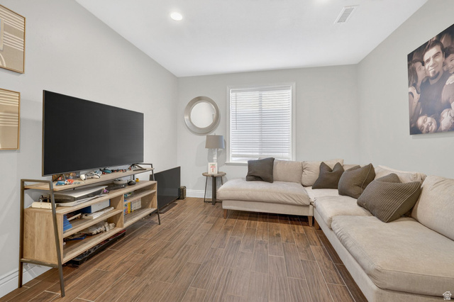 14738 Tangle Hill Road Herriman, UT 84096 - Photo 46 of 66 Spacious room featuring wood-finish flooring, a window with blinds, and recessed lighting