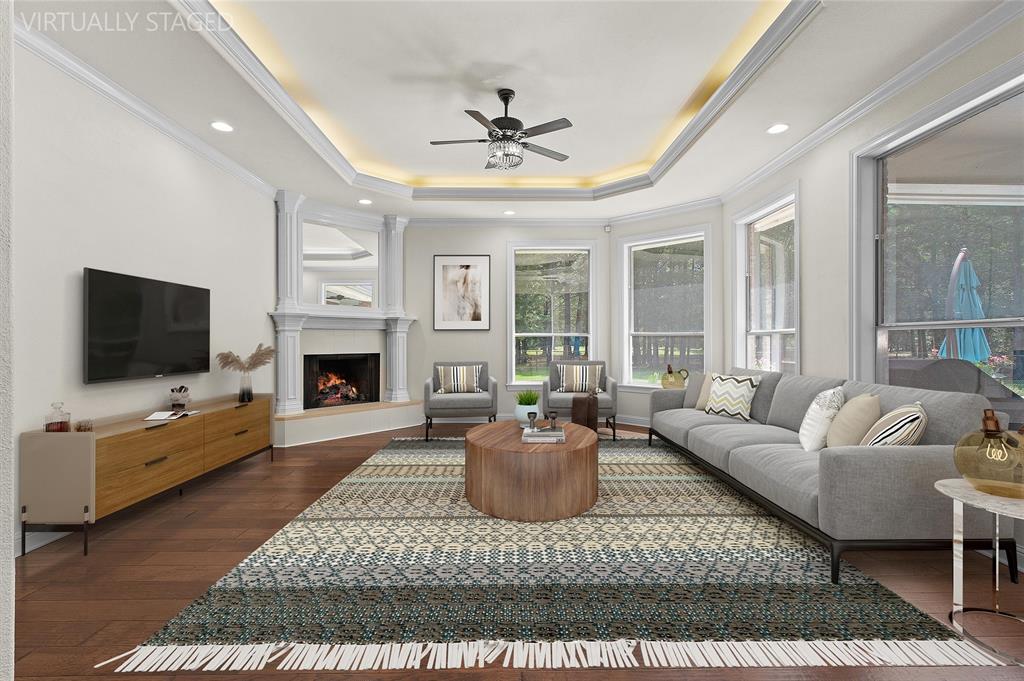 2584 Butler Hill Road Benton, LA 71006 - Photo 12 of 37 a living room with furniture a flat screen tv and a fireplace