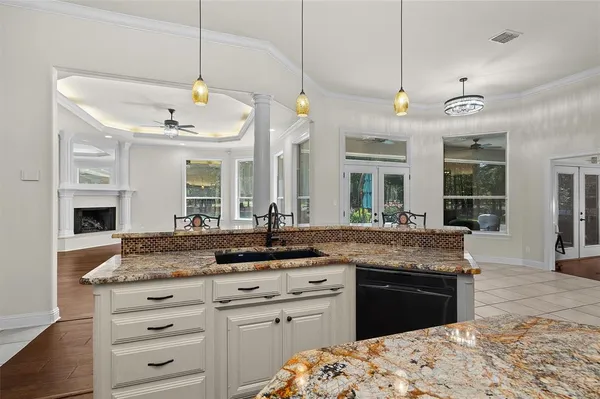 a kitchen with a sink stove and microwave