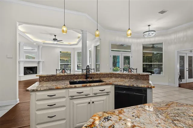 a kitchen with a sink stove and microwave