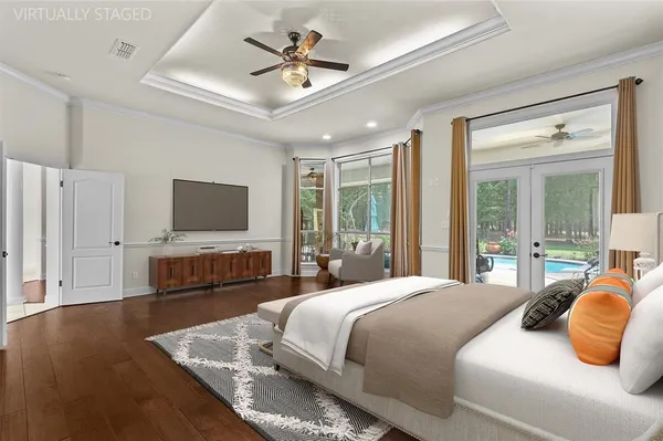 a bedroom with a bed outdoor view and a large window