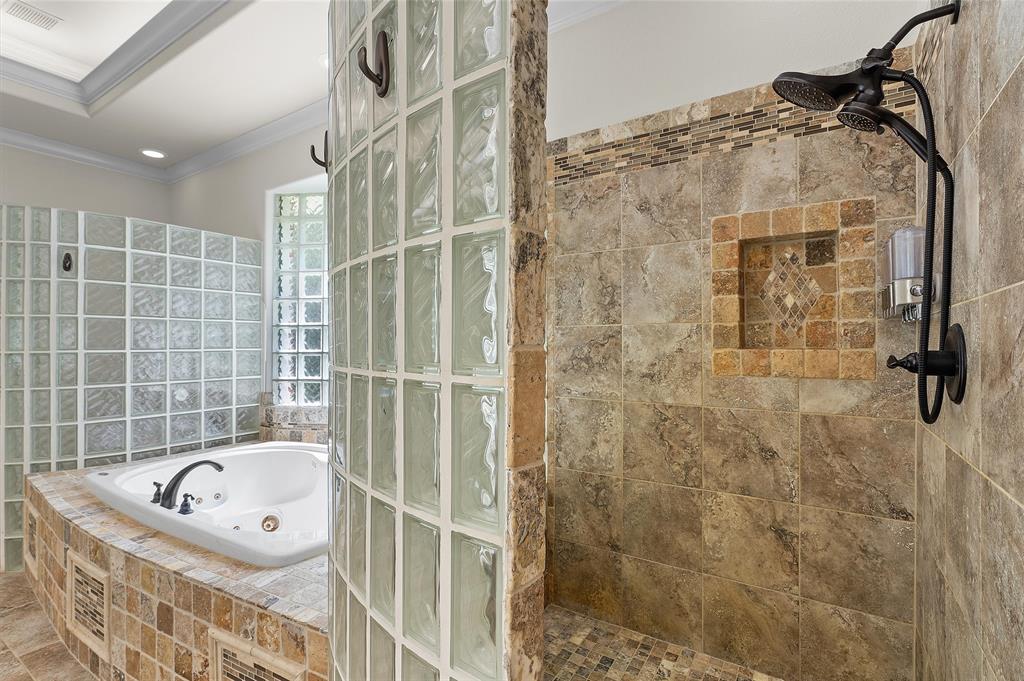 2584 Butler Hill Road Benton, LA 71006 - Photo 27 of 37 a bathroom with a bathtub and shower