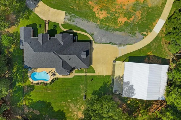 an aerial view of residential house with outdoor space