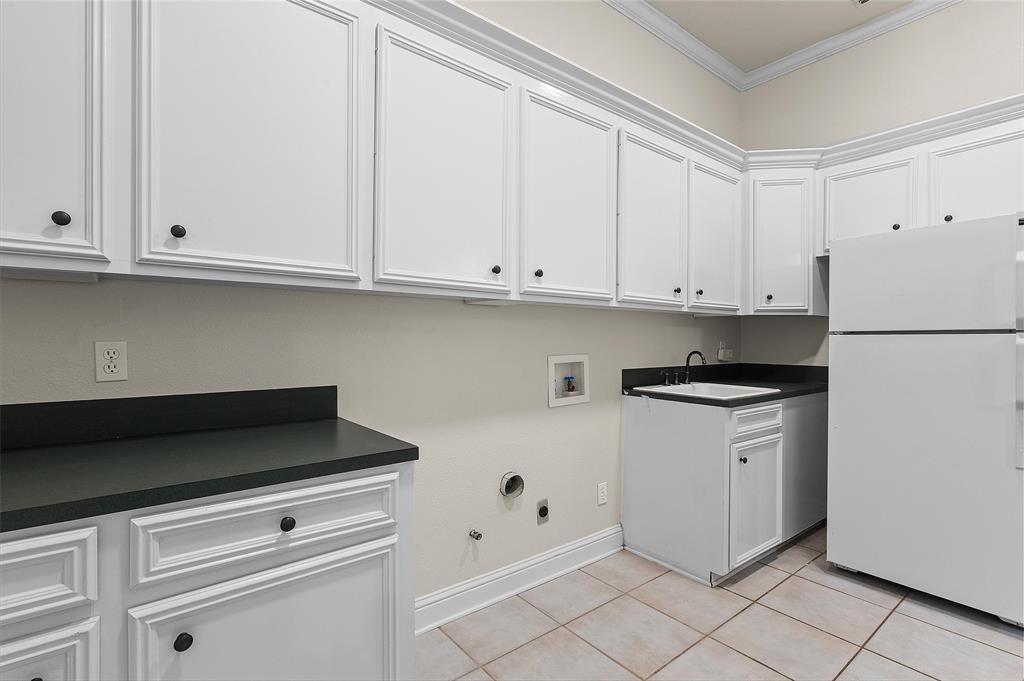 2584 Butler Hill Road Benton, LA 71006 - Photo 31 of 37 a kitchen with white cabinets and white appliances