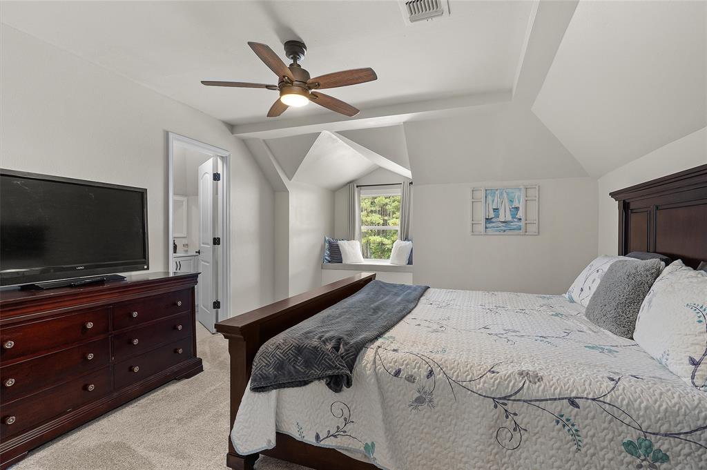 2584 Butler Hill Road Benton, LA 71006 - Photo 32 of 37 a bedroom with a bed and a flat screen tv