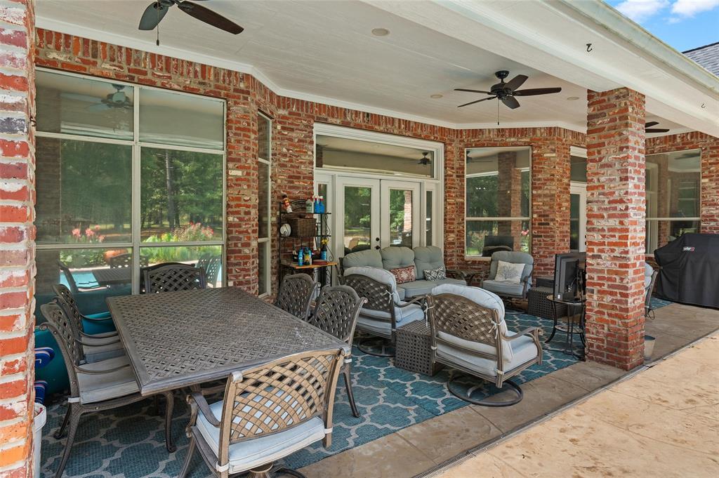 2584 Butler Hill Road Benton, LA 71006 - Photo 8 of 37 a view of a patio with couches table and chairs and potted plants