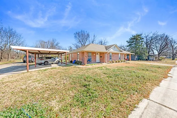 a front view of house with yard and seating area
