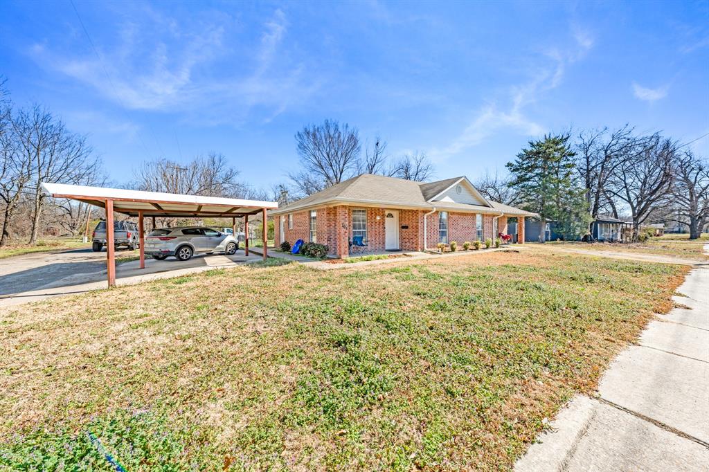 a front view of house with yard and seating area