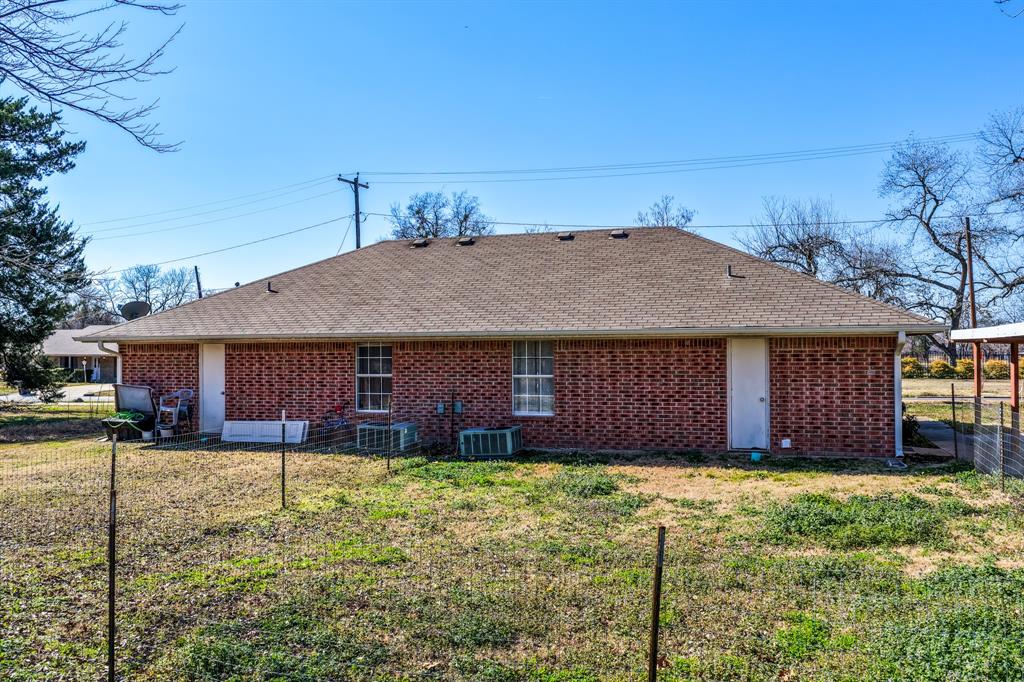 701 Southwest 1st Street Cooper, TX 75432 - Photo 21 of 22 front view of a house with a yard